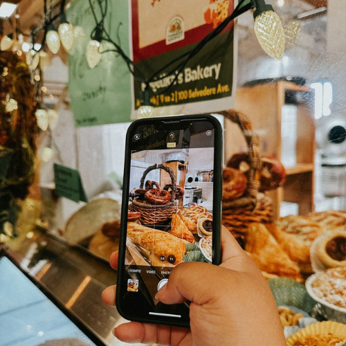 Image of mobile phone taking pic at Charlottetown Farmers' Market